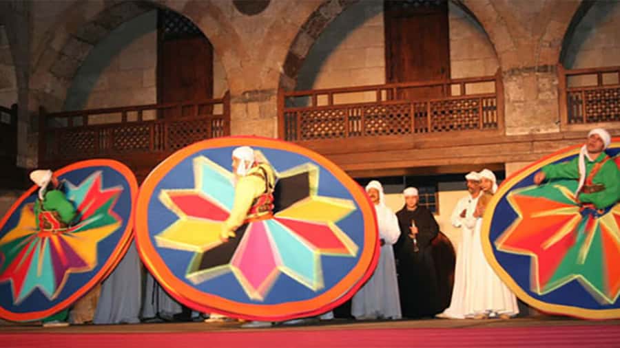 Cairo: Egyptian Heritage Tanoura Dancing Troupe Show - The whirling dervish (Darawish) segment and the atmosphere shift