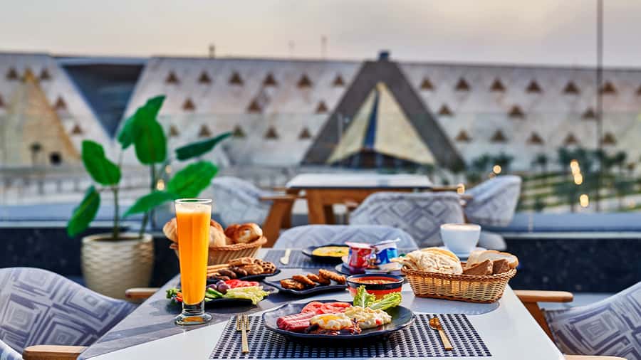Cairo: Sunrise Camel Ride, Pyramids Tour & Local Breakfast. - Sunrise camel energy on the Giza plateau