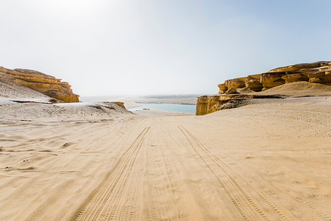From Cairo: Desert Safari, Waterfalls, Sand boarding and Camel ride with Lunch - The itinerary rhythm: waterfalls, Mudawara Mountains photos, then desert play