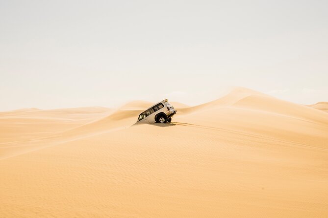 From Cairo: Desert Safari, Waterfalls, Sand boarding and Camel ride with Lunch - Pickup, timing, and how the 9-hour day really feels