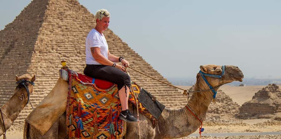 Giza: Pyramids at Sunset Guided Camel Tour - Getting up close to the Great Sphinx in guided time