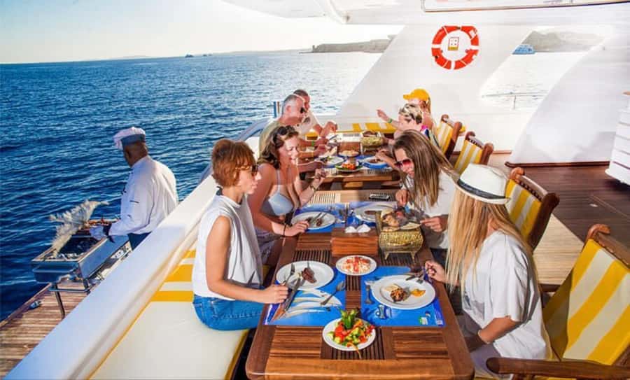 Hurghada: Elite vip snorkeling cruise with BBQ buffet lunch - The Red Sea boat life: drinks, massage beds, and where to sit