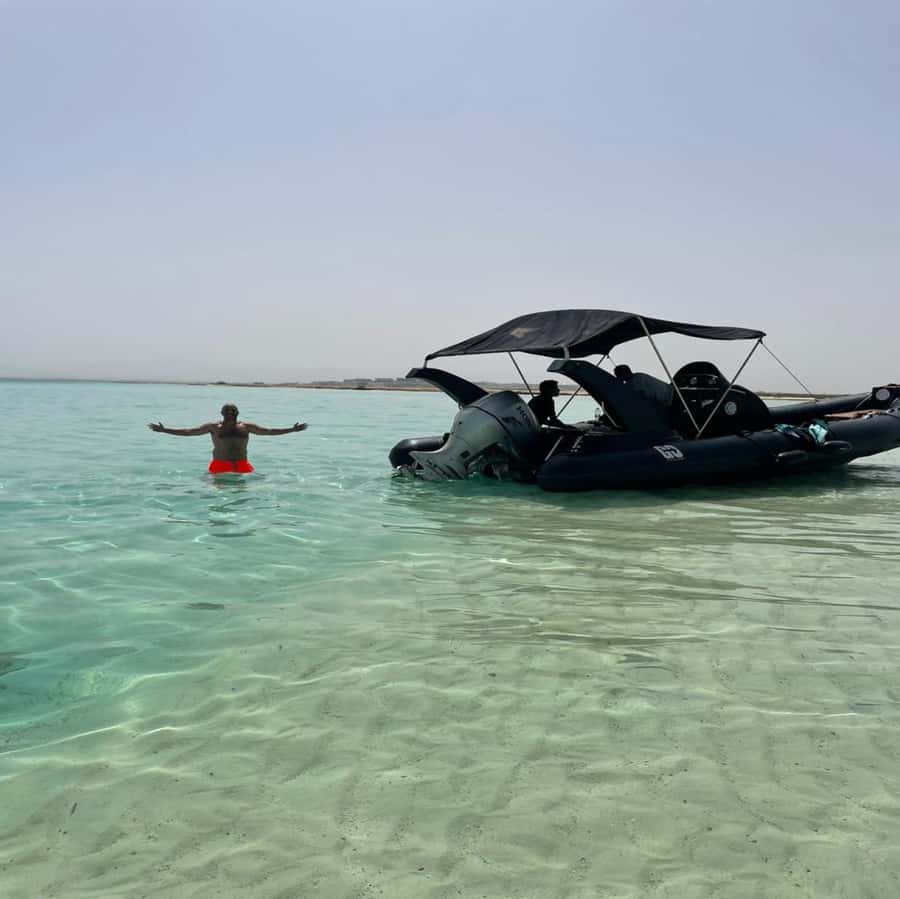 Hurghada: Giftun Island Orange Bay Speedboat Cruise & Lunch - Food and drinks: seasonal fruit, water, and likely lunch