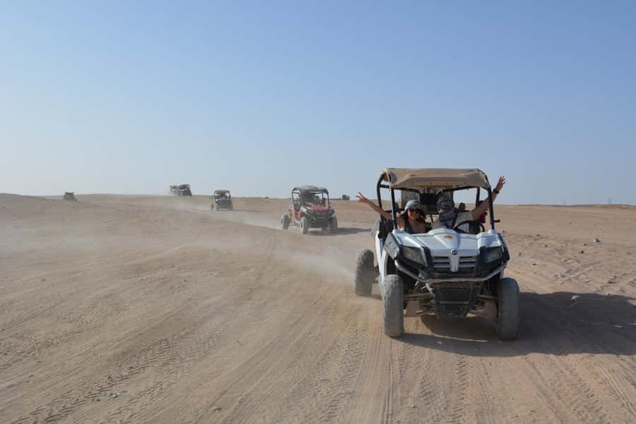 Hurghada: Quad and Buggy Safari with Dinner and Show - What to bring for a dust-filled evening that can get cool